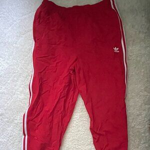 Red adidas track pants